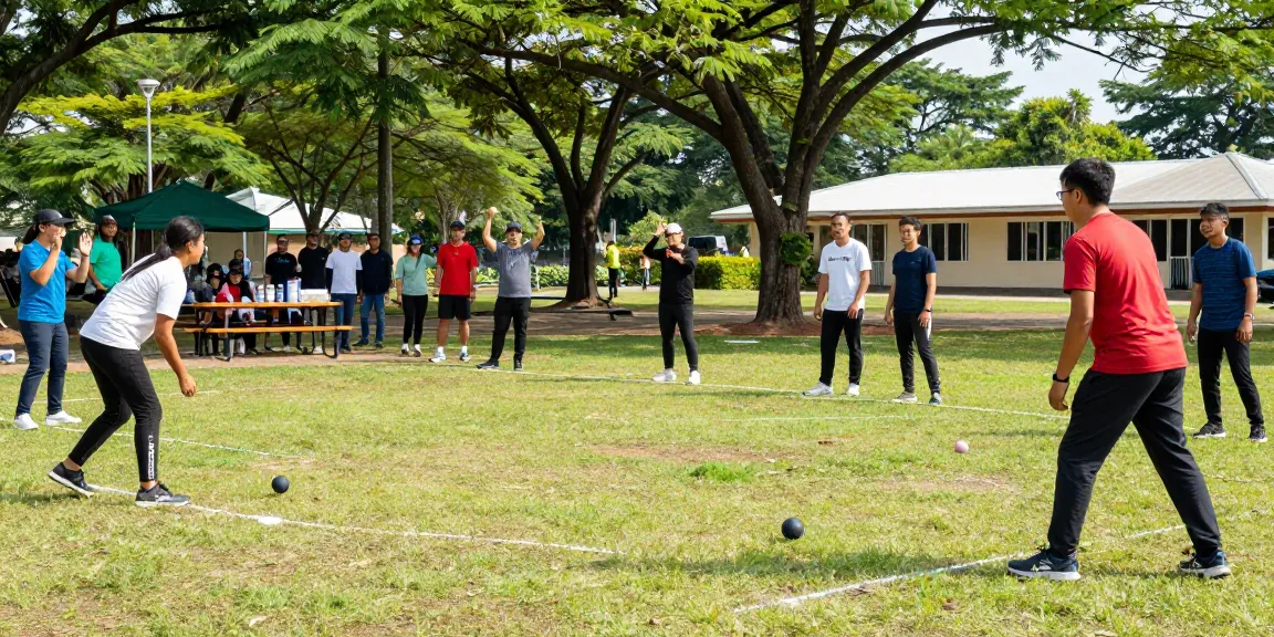 Aktivitas permainan petanque di fopikotabitung.org, para pemain beragam berkompetisi di taman yang cerah.
